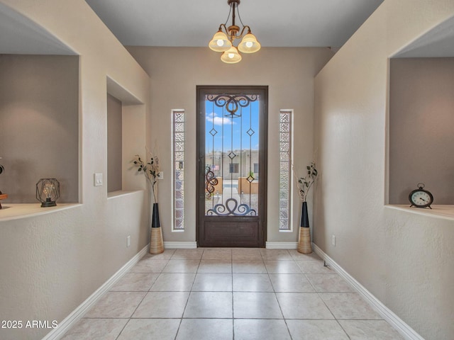 2724 W Fernwood Dr, Phoenix, AZ 85086 - entryway featuring a notable chandelier, tile patterned flooring, and baseboards