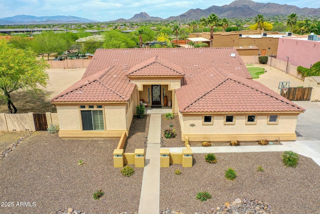 2724 W Fernwood Dr, Phoenix, AZ 85086 - mediterranean / spanish-style home featuring a mountain view, stucco siding, fence, and a tile roof