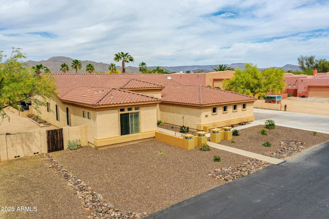 2724 W Fernwood Dr, Phoenix, AZ 85086 - view of front of property with a mountain view, stucco siding, fence, and a tile roof