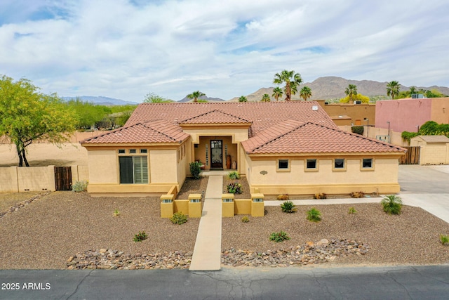 2724 W Fernwood Dr, Phoenix, AZ 85086 - mediterranean / spanish-style house featuring fence, stucco siding, a tiled roof, and a mountain view