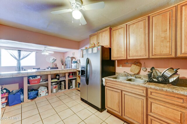 6541 N 54th Ave, Glendale, AZ 85301 - kitchen featuring stainless steel fridge with ice dispenser, ceiling fan, a sink, light tile patterned flooring, and light countertops