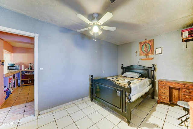 6541 N 54th Ave, Glendale, AZ 85301 - bedroom with light tile patterned floors and ceiling fan