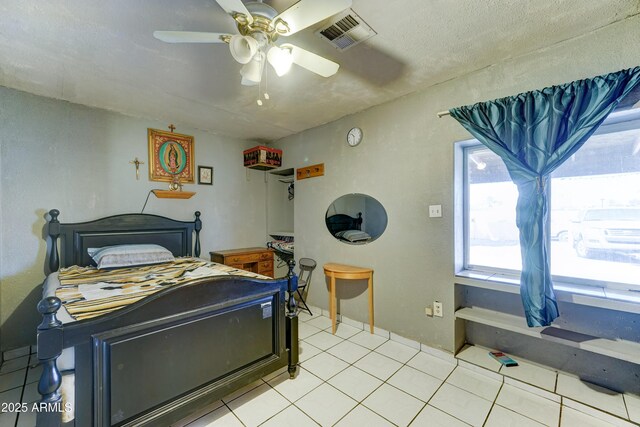 6541 N 54th Ave, Glendale, AZ 85301 - bedroom featuring multiple windows, light tile patterned flooring, and a ceiling fan