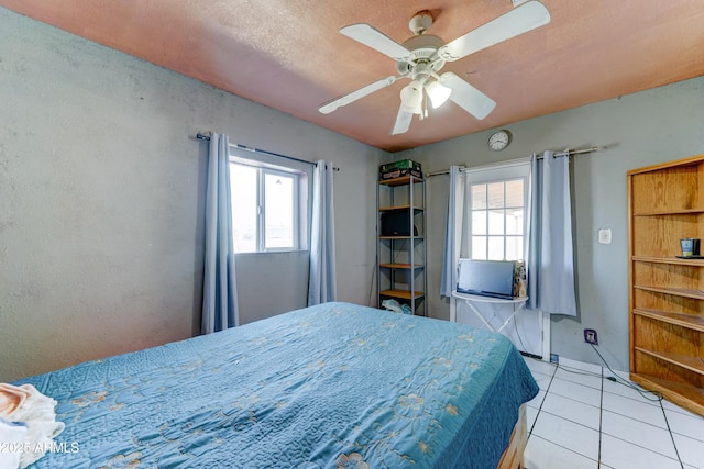 6541 N 54th Ave, Glendale, AZ 85301 - bedroom with multiple windows, light tile patterned flooring, and ceiling fan