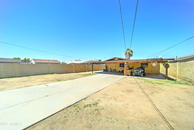 6541 N 54th Ave, Glendale, AZ 85301 - rear view of property with concrete driveway and a carport