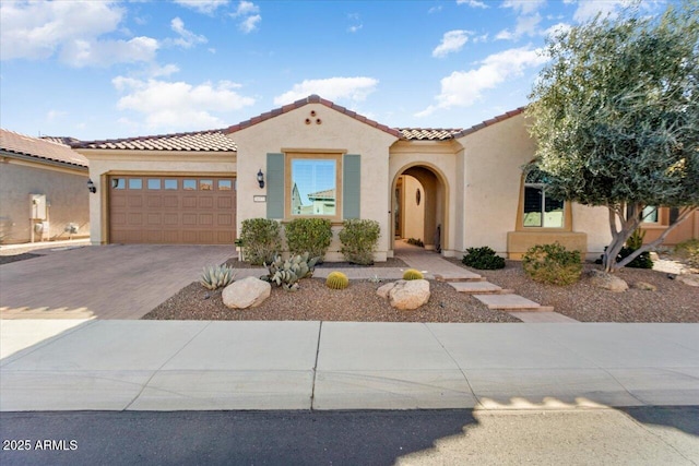 mediterranean / spanish-style home featuring a garage