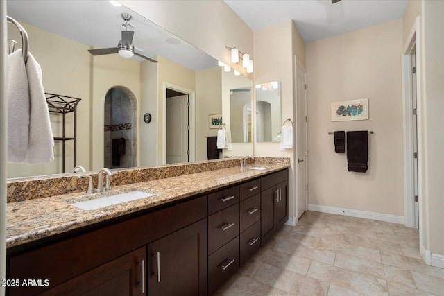 bathroom featuring vanity and ceiling fan