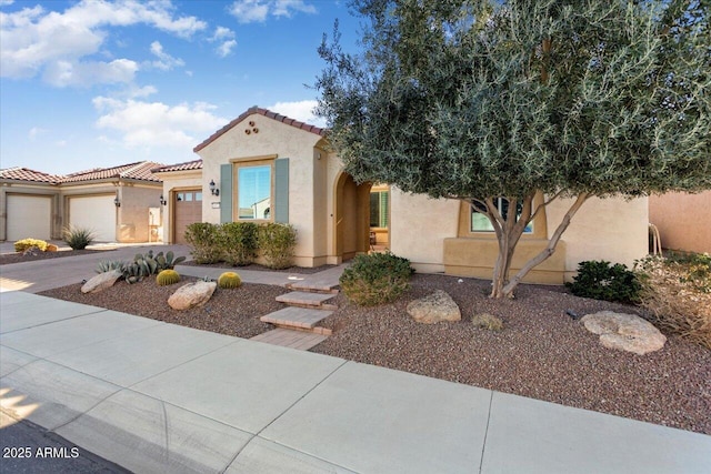 mediterranean / spanish-style house featuring a garage