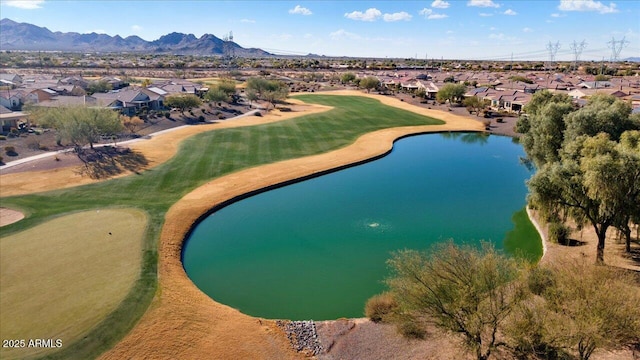 birds eye view of property featuring a water and mountain view