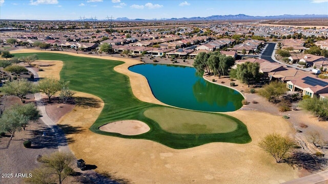 birds eye view of property featuring a water and mountain view