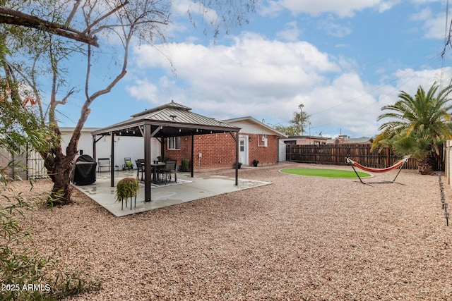 view of yard with a gazebo, fence, and a patio