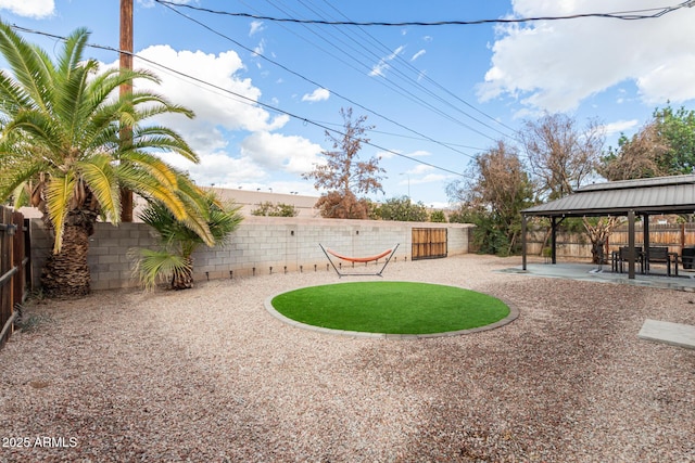 view of yard with a gazebo, a fenced backyard, and a patio