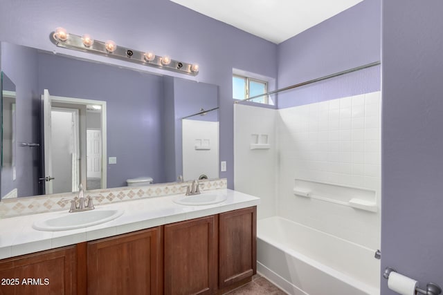 full bathroom featuring vanity, shower / bathtub combination, and toilet