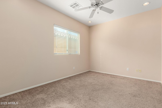 unfurnished room featuring ceiling fan and carpet flooring