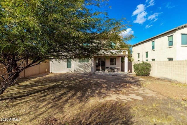 rear view of property with a patio area