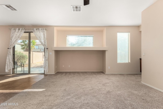 unfurnished room featuring carpet flooring