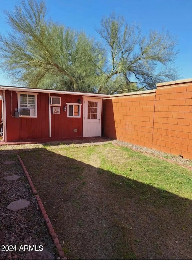 view of outdoor structure with a lawn