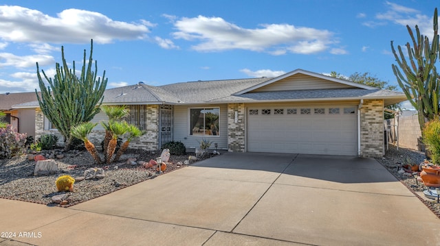 ranch-style home featuring a garage