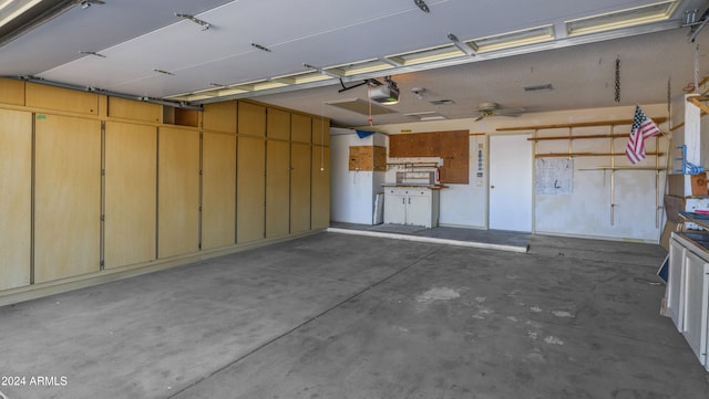 garage with ceiling fan and a garage door opener