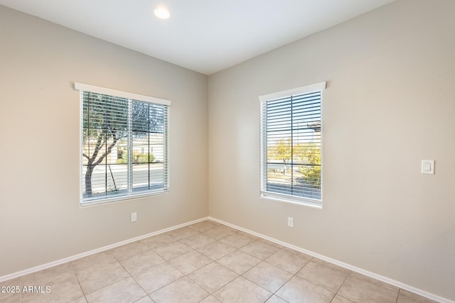 empty room with light tile patterned floors