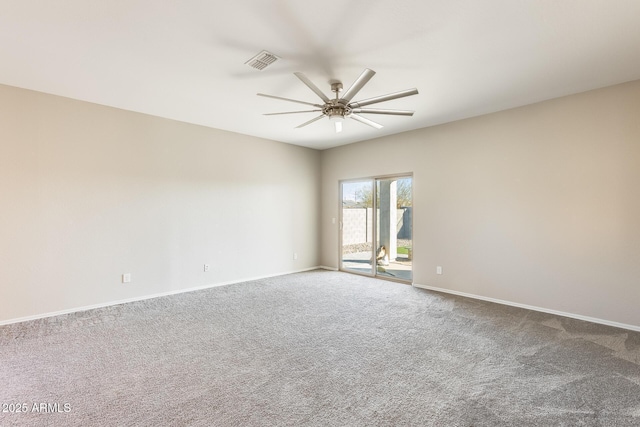 carpeted empty room featuring ceiling fan