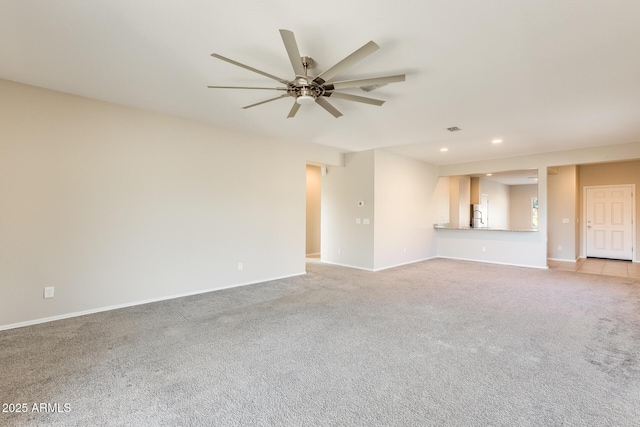 unfurnished living room with ceiling fan and light colored carpet