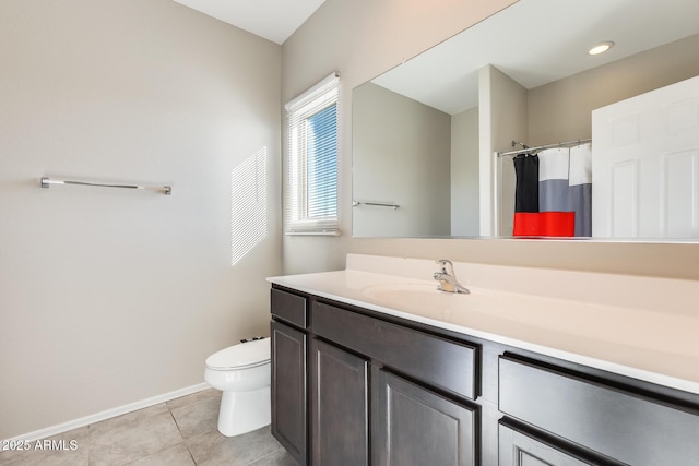 bathroom featuring toilet, vanity, a shower with curtain, and tile patterned flooring