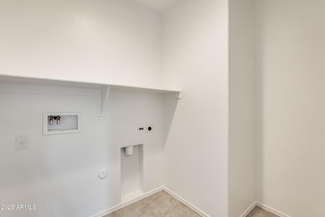 clothes washing area featuring washer hookup, hookup for an electric dryer, and gas dryer hookup