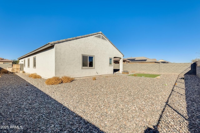 rear view of house with a patio