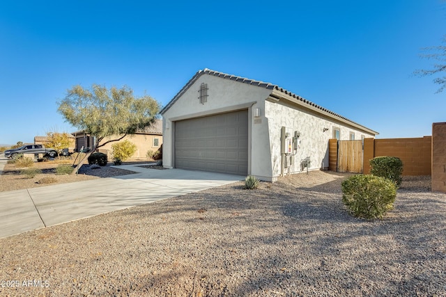 view of side of home with a garage