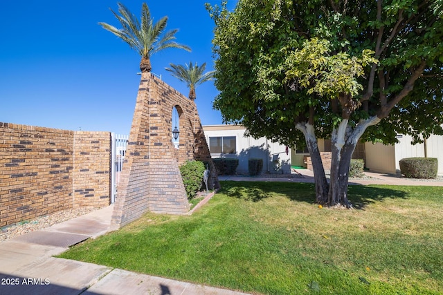 exterior space with a lawn and stucco siding