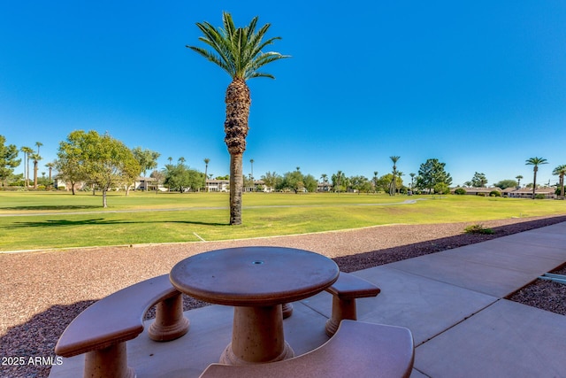 view of home's community featuring a lawn