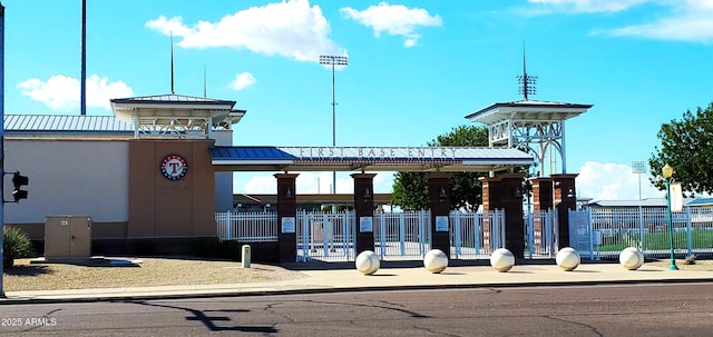 view of home's community featuring fence