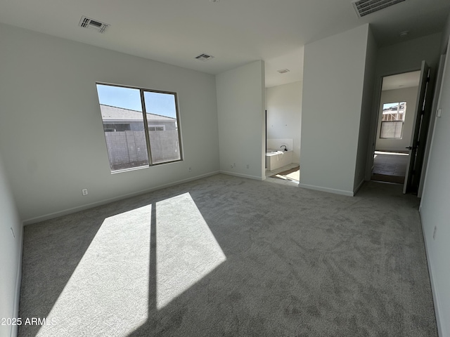 unfurnished bedroom featuring visible vents and carpet flooring