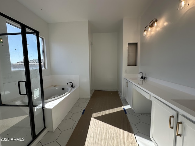 full bathroom with tile patterned flooring, a sink, a shower stall, and a bath