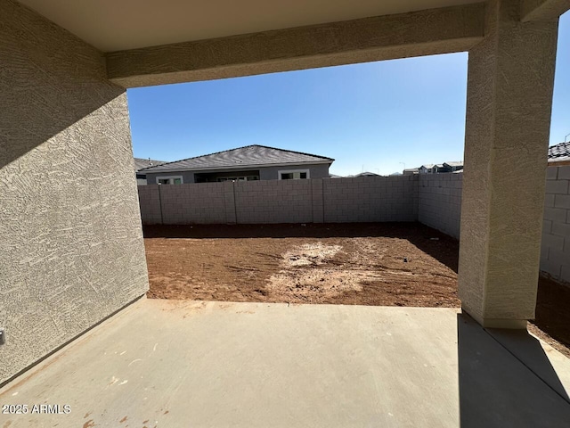 view of yard featuring a patio area and a fenced backyard