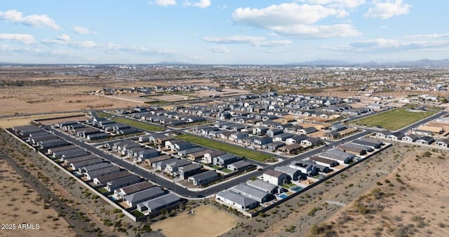 birds eye view of property with a residential view