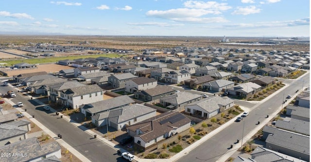 birds eye view of property with a residential view