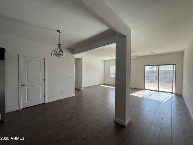 empty room with dark wood-type flooring