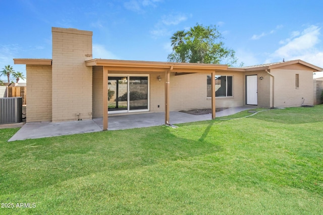 4062 W Eva St, Phoenix, AZ 85051 - back of property featuring brick siding, cooling unit, a patio, and a chimney
