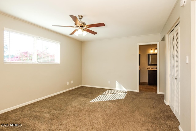 4062 W Eva St, Phoenix, AZ 85051 - unfurnished bedroom with dark colored carpet, baseboards, a closet, and ornamental molding