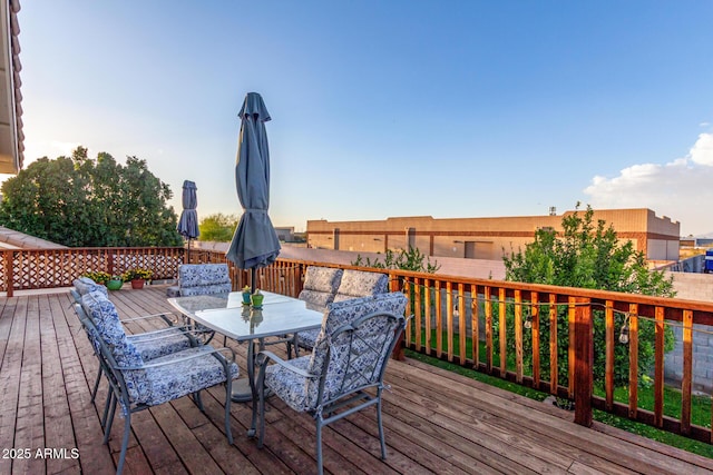 wooden deck featuring outdoor dining space