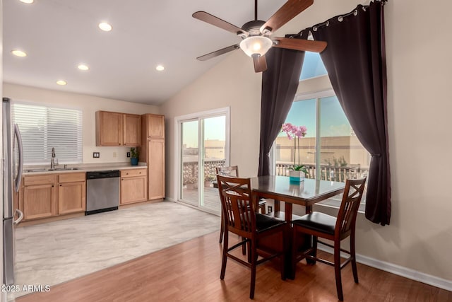 dining area featuring lofted ceiling, light wood finished floors, recessed lighting, and baseboards