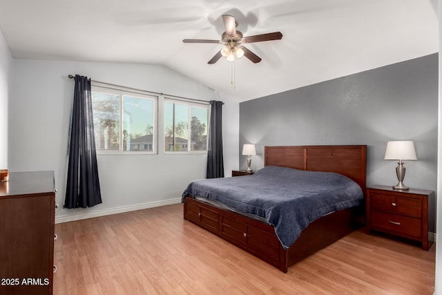 bedroom with lofted ceiling, baseboards, a ceiling fan, and light wood-style floors