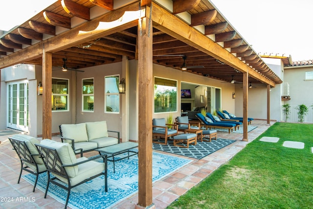 view of patio with ceiling fan and an outdoor living space