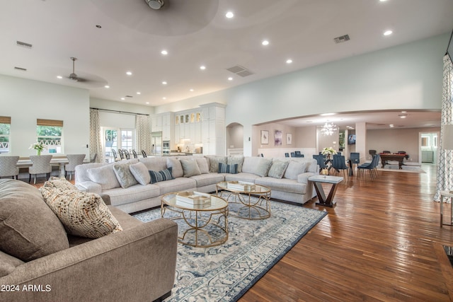 living room featuring billiards, dark hardwood / wood-style floors, and ceiling fan with notable chandelier