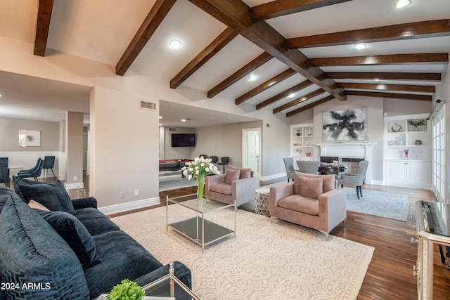 living room with built in shelves, lofted ceiling with beams, and dark hardwood / wood-style floors