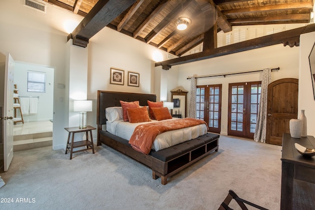 bedroom with beamed ceiling, high vaulted ceiling, french doors, and carpet floors