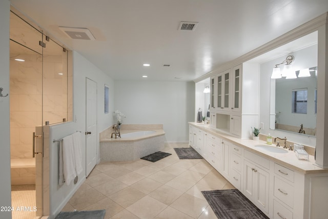 bathroom featuring vanity, tile patterned floors, and independent shower and bath