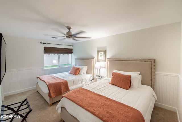 bedroom featuring ceiling fan and light colored carpet